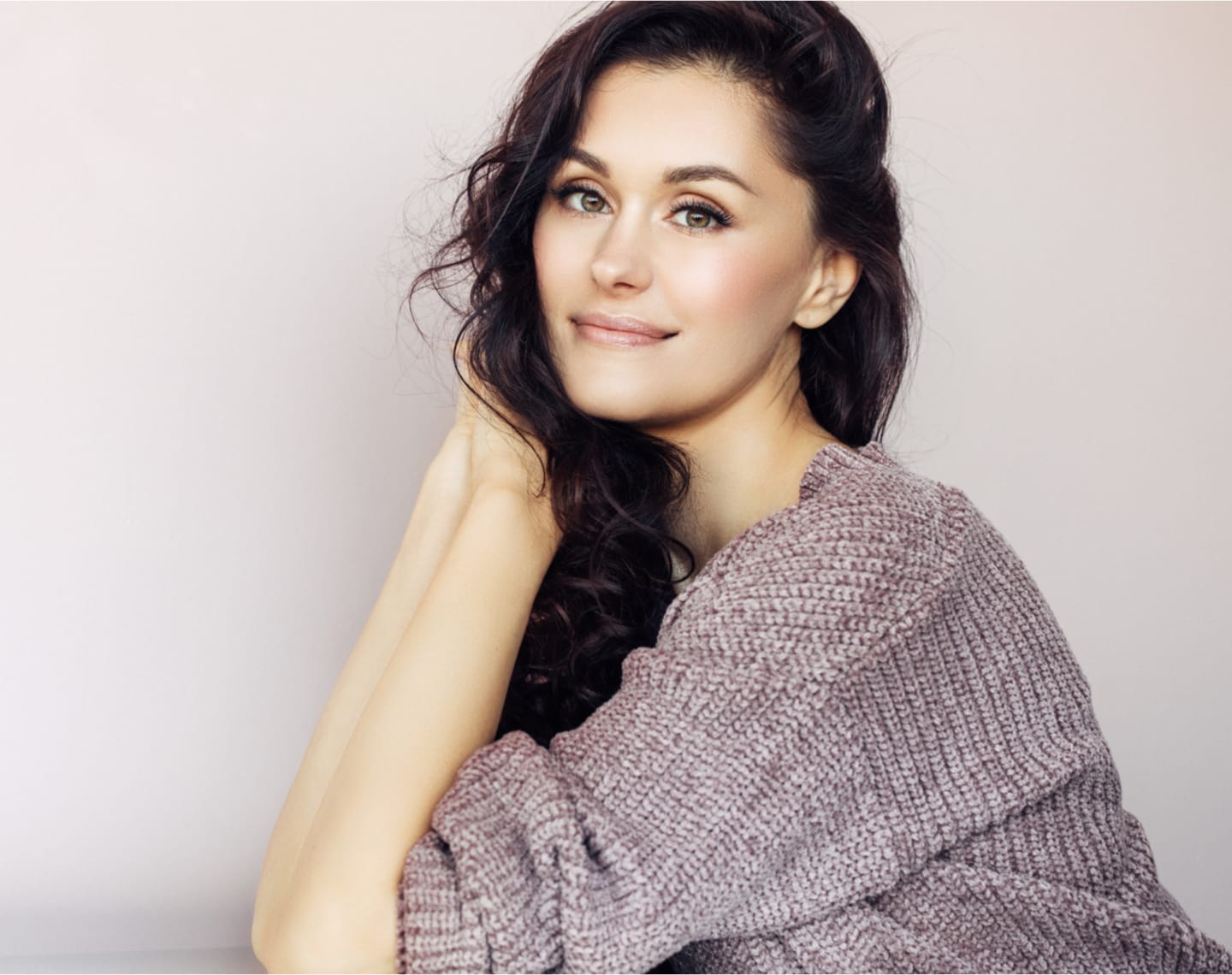 Woman smirking, looking to the side