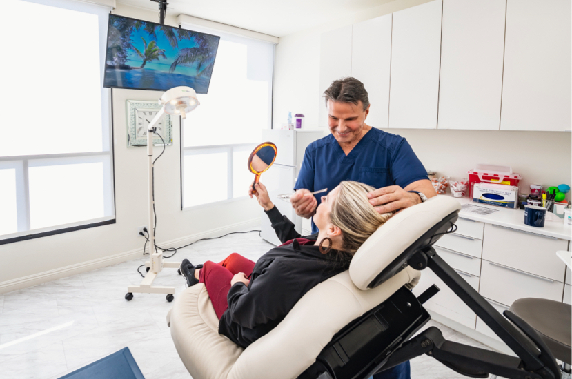 Dr. Joe Cerni consulting with patient after facial procedure